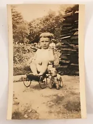 Good condition, slight curl. May have had margins cropped. Adorable photo.