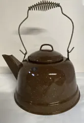 Brown and white speckled vintage tea kettle. In wonderful condition. I don’t see any chipping or wearing of the...