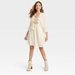 •Bishop 3/4 sleeve A-line dress •Lightweight crepe fabric •Embroidered eyelet pattern on the top •Split...