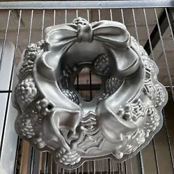 Nordic Ware Holiday Christmas Wreath Cake Pan Ribbon Bundt Cast Aluminum 9 Cup. Excellent used condition. Please look...