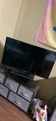 40 inch television with rotating stand, amazon firestick included.