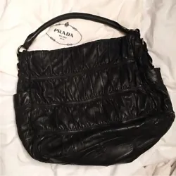 This is an authentic PRADA Nappa Leather Gaufre Hobo in Nero Black. This is a distinctive large shoulder bag...