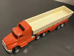 1995 New Ray red semi with open flat hauling trailer Plastic 6.5 Inches. Measures approximately 6.5 inches from front...
