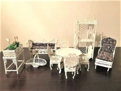 The set contains a settee/love seat and chaise lounge with padded and tufted floral cushions and each has removable.