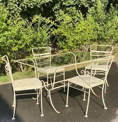 Vintage Wrought Iron Glass Top Patio Table And 4 Chairs, Early to Mid 1900s. Well loved through a few generations...