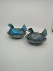 This lot of two vintage Indiana Glass iridescent carnival hen on nest dishes is a beautiful addition to any collection....