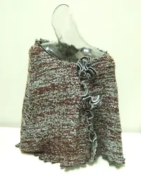 Soft boucle style knit shawl or cape. Three snap closures on front. Knit is chocolate and ice blue. 100% acrylic, and...