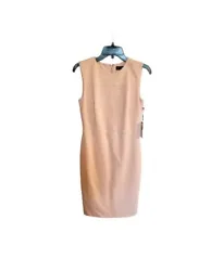This beautiful sleeveless pink dress by Ivanka Trump is sure to turn heads at any event. With a round neckline and zip...