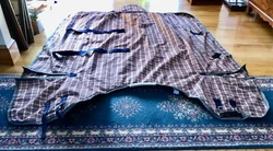 5/A Baker Plaid Curvon 400-500 gram1200d Turn Out Blanket. Excellent condition, beautiful blanket. Marked as a 82....