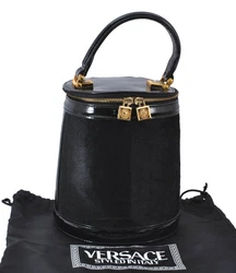 Material Unborn Calf. Accessory Dust Bag. Pocket Inside Pocket has a little dingy,rubbed. Style Hand Bag. Color Black....