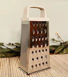 Vintage Retro Stainless Steel Cheese Grater - White Handle. Excellent Pre-owned condition. Handle is a plastic...