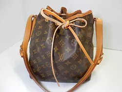 100% Authentic Louis Vuitton Monogram Petit Noe. Stains, wears, rubbing, scratches, wrinkles and cracks on the...