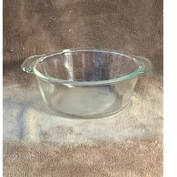 Bowl features side scalloped handles, heavy duty glass, made in the USA, dishwasher/microwave/oven safe. No stains or...