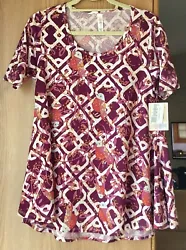 Lularoe t-shirt size xxs. Please See photos for material,care and measurements