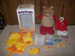 This listing is for a lot of 1985 World Of Wonder Teddy Ruxpin With Box, Tapes, & Clothing Outfits.  Everything shown...