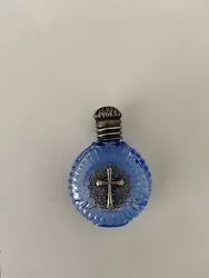 holy water bottle -glass-blue,antique silver screw top lid with rubber seal.Antique silver pressed motif of Holy Cross....