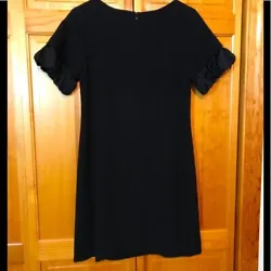 Bust 17”, Length 35. Very good preowned condition. Black knit with satin accent trim on sleeves!