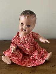Antique doll with dress.