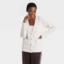 •Cable-knit sweater cardigan in solid color •Heavyweight fabric blend •V-neck front with sparkly buttons •Long...